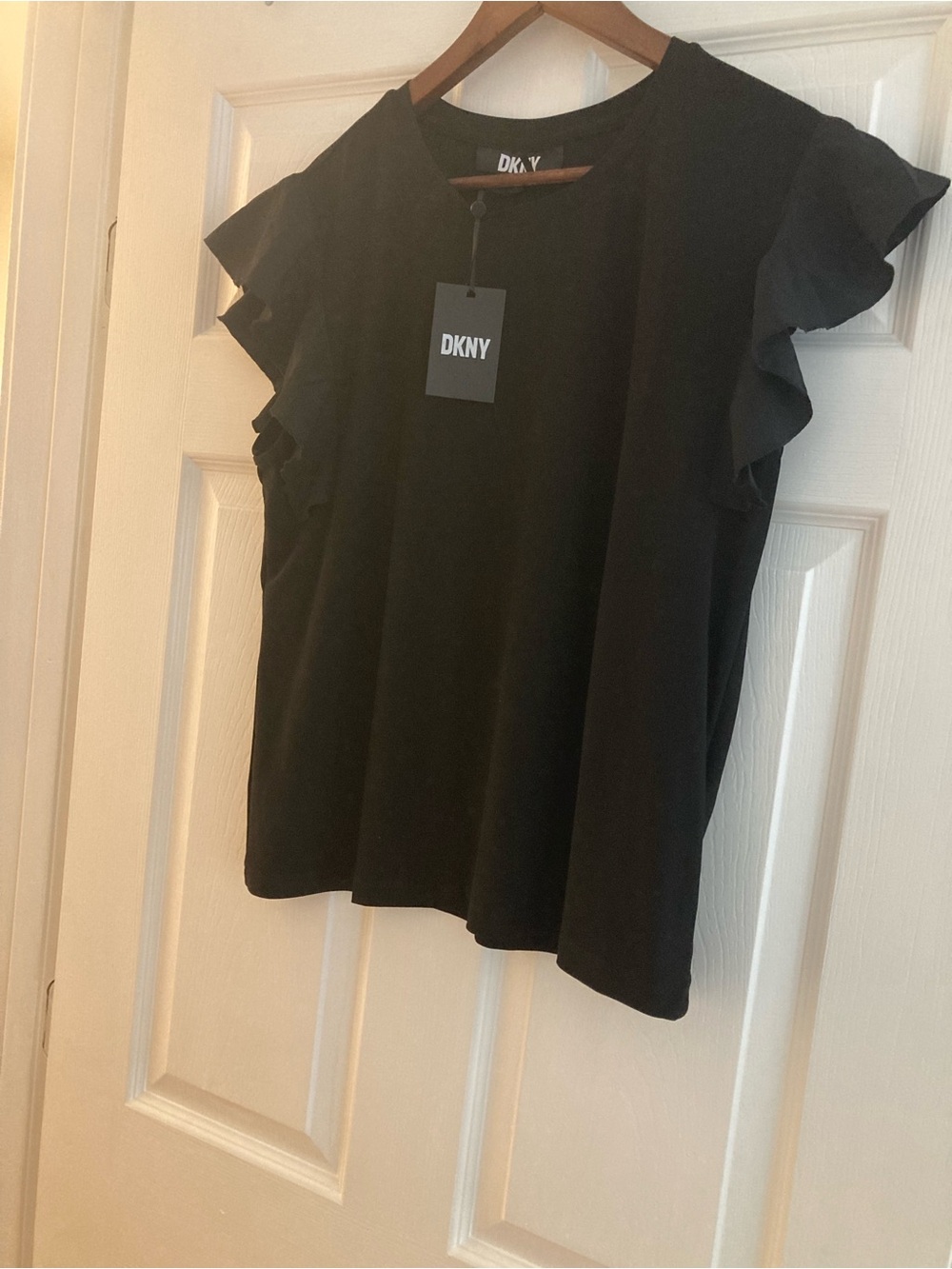 DKNY large NWT Black blouse with flutter cap sleeves